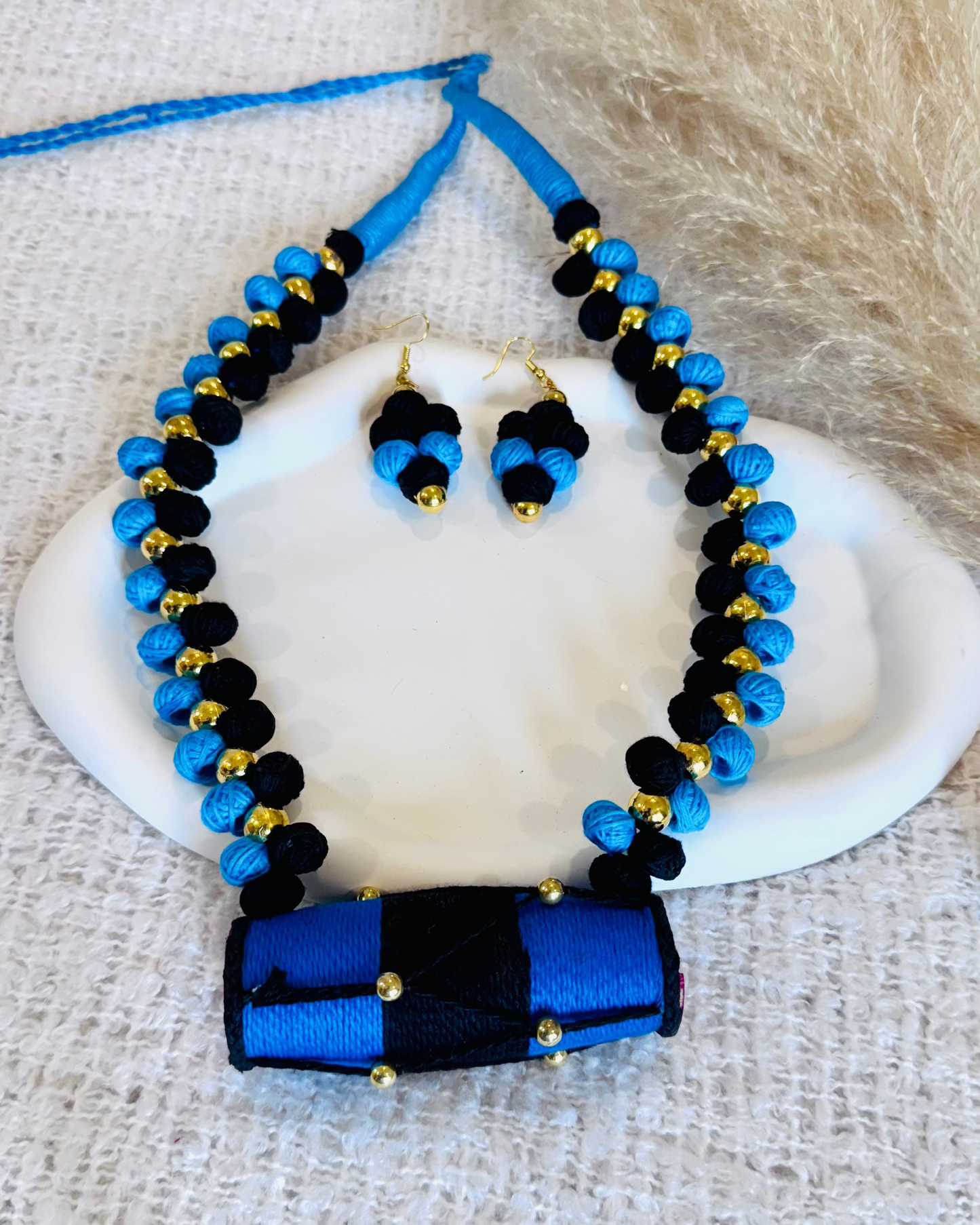 Blue and black beaded necklace and earrings